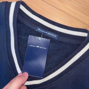 Brand new with tags Brandy Melville navy blue and white varsity sweater
